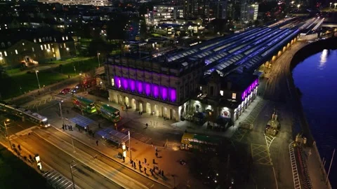 Historic Dublin Train Station with Vibrant Purple Facade at Night Stock Footage 332444607