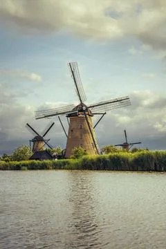 Historic Dutch architecture featuring multiple windmills in Kinderdijk Neth.. Stock Photos