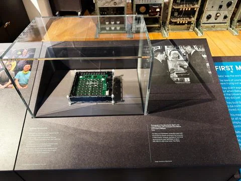 Historic early SpiNNaker computer circuit board displayed under glass at a .. Фото