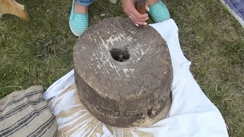 Historic hand-driven millstone Stock Footage 79676374