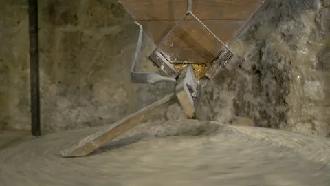 Historic hand-driven millstone grinding wheat - extreme close-up (right side) Stock Footage 94193270