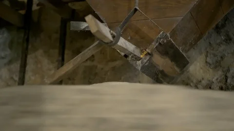 Historic hand-driven millstone grinding wheat - extreme close-up (right side low Stock-Footage 94259456