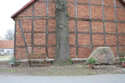 Historic house with tree, stone elements, embodying aged and nostalgic Stock Photos