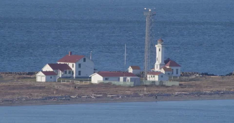 Historic light house with tourists form a distance Stock Footage 175934603