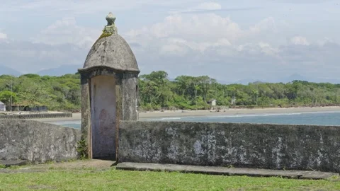 Historic Lighthouse on Ilha do Mel, Brazil with Ocean and Green Forest Vídeos de archivo 336454848