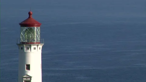 Historic Lighthouse with sparkling ocean Stock Footage 44459321