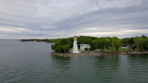 Historic Marblehead lighthouse during cloudy day at Lake Erie shore in Ohio.. Stock Footage 322960737