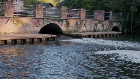 Historic mill and weir pool Video stock 251603799