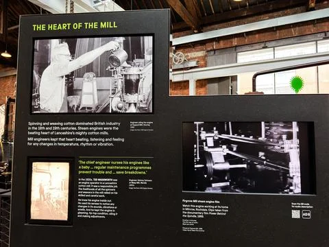 Historic mill steam engine exhibit and engineer photo display at industrial.. Stock Photos