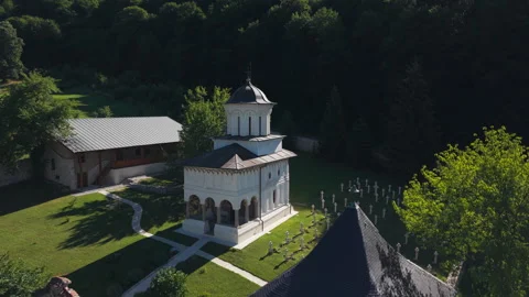 Historic Monastery Chapel and Cross-Filled Cemetery Stock Footage 341387008