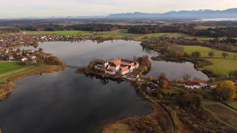 Historic monastery complex Kloster Seeon with St. Nikolaus Chapel, seen from Stock Footage 320407558
