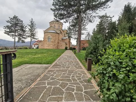 Historic monastery at end of stone path Foto stock