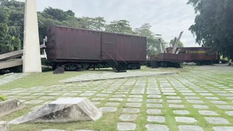 A historic monument in Cuba with old train cars Stock Footage 313244909
