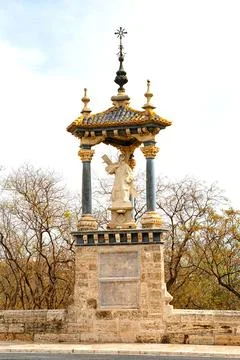 A Historic Monument Featuring a Statue in a Stone Pavilion Surrounded by Trees Stock Photos