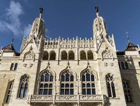 Historic Neo-Gothic Building Facade with Ornate Details and Spires Stock Photos