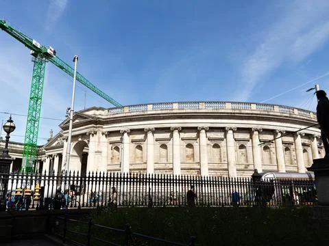 Historic neoclassical gallery facade with construction crane in Dublin, Ire.. Stock Photos