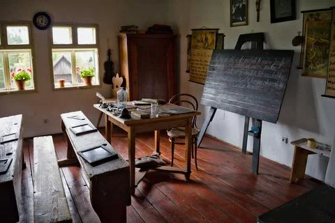 Historic Old-Fashioned Classroom Interior With Wooden Benches And Chalkboard Stock Photos