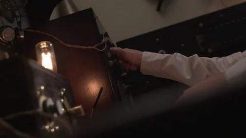 Historic Old Telegraph Technology Operator turns knob - Morse Code Stock Footage 92341086