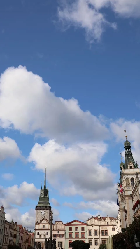 Historic Pardubice town square under blue sky with drifting white clouds Stock Footage 344054688