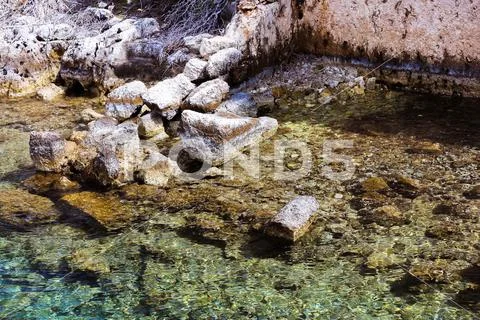Historic place on the shore of the sea and under clear, clean water Stock Photos