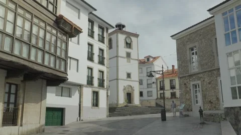 Historic Plaza and Clock Tower in Luanco, Asturias, Spain Walking Through Stock Footage 337452755