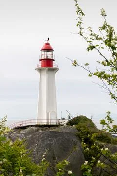 Historic Point Atkinson Lighthouse on the Salish Sea vertical 스톡 사진