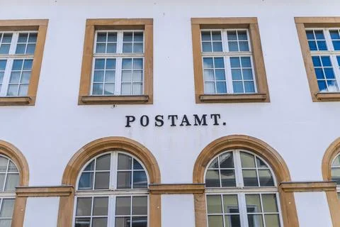 Historic Post Office Facade with Arched Windows Stock Photos