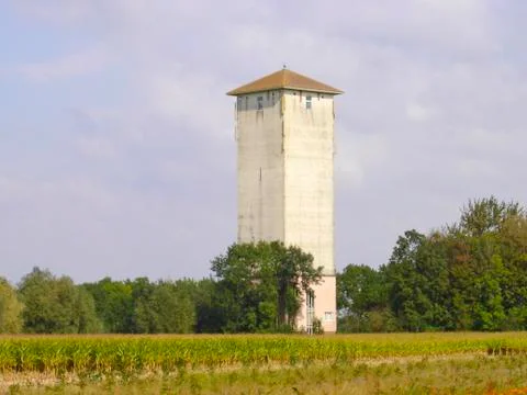 Historic quadrangular white water tower Stock Photos