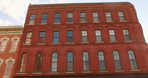 Historic Red Brick Building Facade in Downtown Dubuque Iowa on Sunny Day Stock Footage 338991235