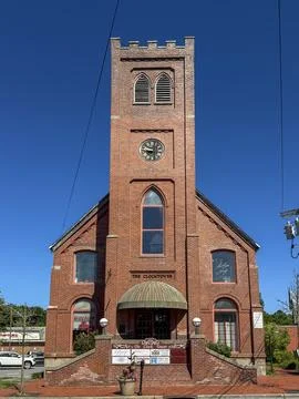 The historic red brick Clocktower building. Stock Photos