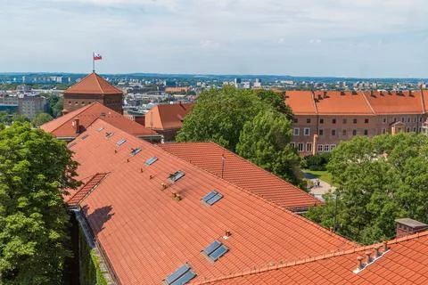 Historic red brick rooftop view over city and nature landscape. Krakow Stock Photos