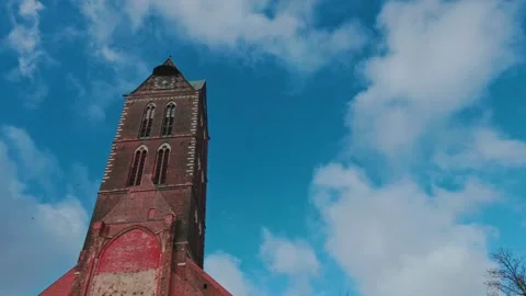 Historic red brick tower of St. Mary's Church in Wismar Video stock 332136379