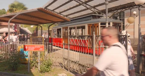 Historic Red Tram and Passengers at Sassi-Superga Tramway Station in Turin Stock Footage 340340198