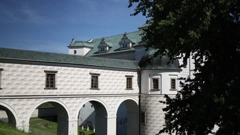 Historic renaissance building with patterned facade and green roof basks in brig Stock Footage 311130679