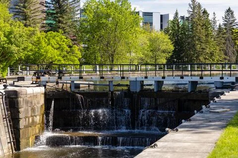 Historic river lock system operating in spring. Waterway infrastructure on Ri Stock Photos
