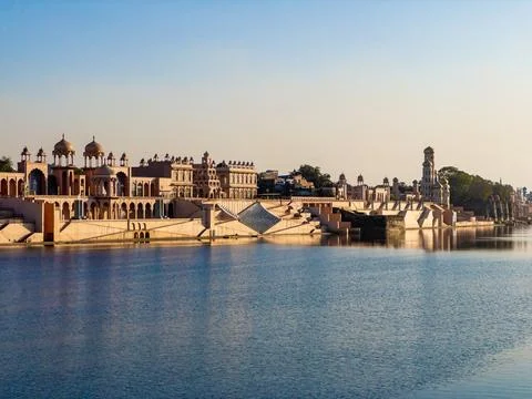 Historic Riverfront Architecture with Reflection on Calm River Stock Photos