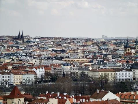 Historic Rooftops Beneath Tranquil Sky. City Rooftops With Spires And River.. Stock Photos
