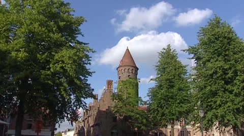 Historic round tower pan to low angle view belfry, Bruges Stock Footage 24025314