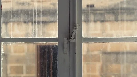 Historic Sandstone Architecture Viewed Through a Vintage Wood Window Stock Footage 330857369