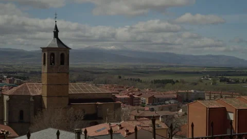 Historic Santo Tomas monastery bell tower standing over old Avila cityscape.. Stock Footage 335642684