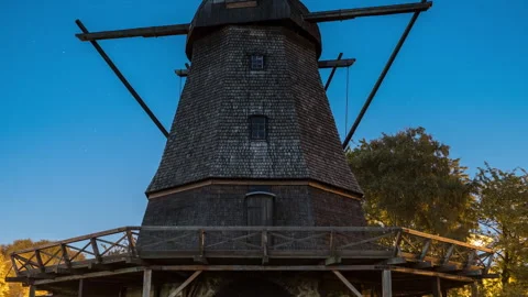 Historic Shingled Wooden Windmill, Low-Angle Tilt Up Stock Footage 343693166