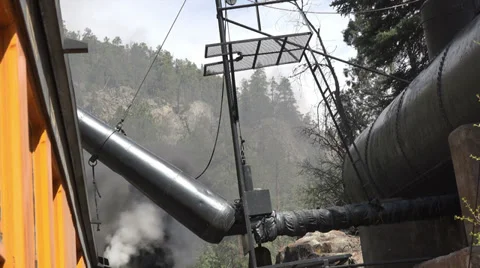 Historic steam train loading water from tank HD Video stock 38598287