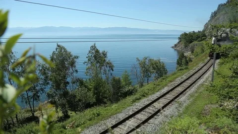 Historic steam train passes through the mountains. Steam locomotive moving Stock Footage 75763819