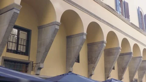Historic Stone Arch Arcade Along Traditional Building Facade in Florence Ital Stock Footage 340749442