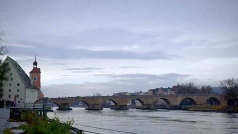 Historic Stone Arch Bridge Over European River Canal with Tourists and Old Town Stock Footage 301494294