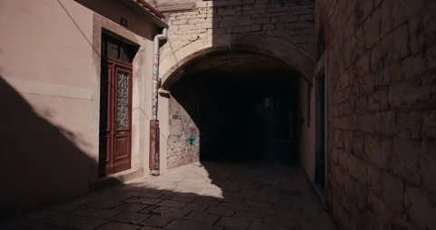 Historic stone archway passage in old town Sibenik Croatia Stock Footage 336256341