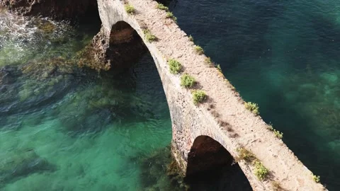 Historic Stone Bridge Over Clear Coastal Waters, Top View Stock Footage 320202566