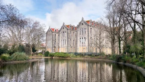 Historic Stone Building Reflections In Park Pond Surrounded Trees, Portugal Stock Footage 328977673