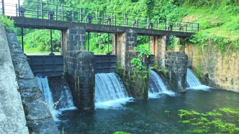 Historic Stone Dam Gates With Cascading Water at Poomala Dam, Thrissur Kera.. Stock Footage 321922693