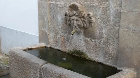 Historic stone fountain pouring fresh water Stock Footage 341282353